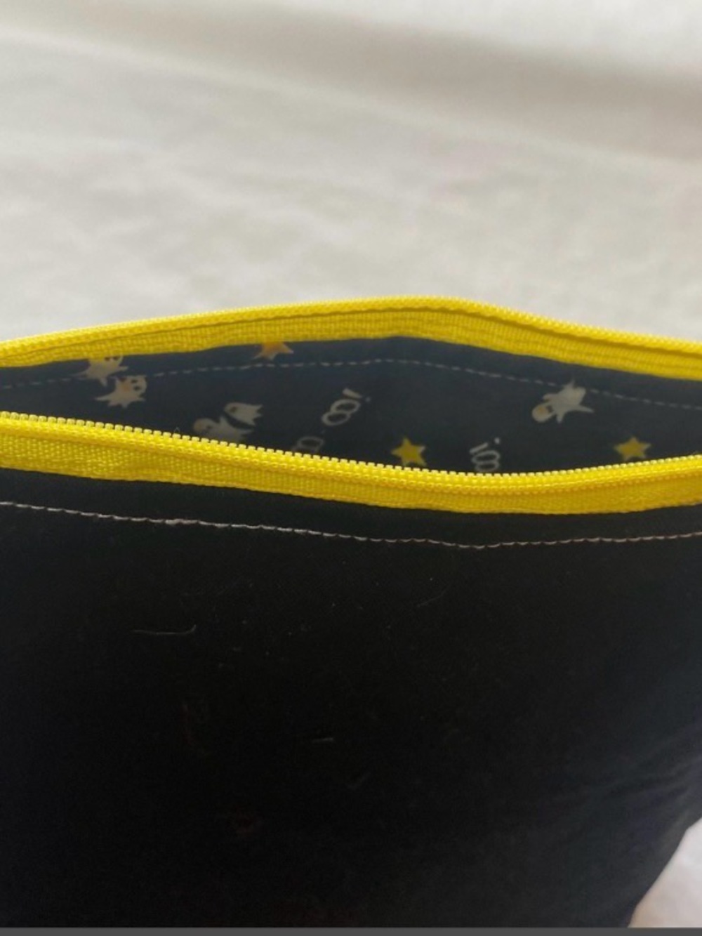 Black Makeup Pouch with Yellow Zip and Star Lining